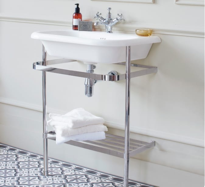 A Burlington natural stone basin fitted to a chrome wash stand.